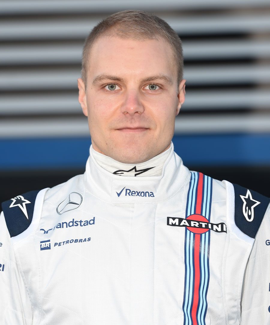 Valtteri Bottas poses for the cameras in his 2015 overalls Valtteri Bottas poses for the cameras in his 2015 overalls